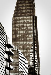 Low angle view of modern buildings against clear sky