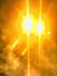 Low angle view of illuminated lights against sky at night