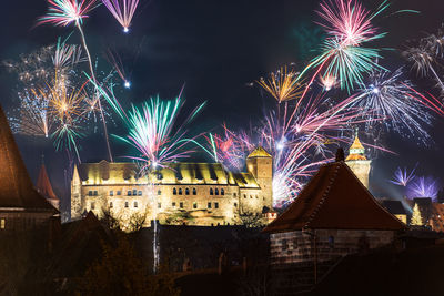 Firework display at night