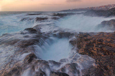 Scenic view of sea against sky during sunset