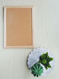 Blank wooden material board and green plants