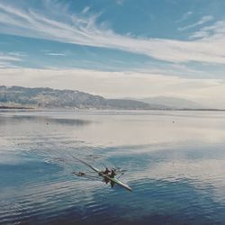 Scenic view of water ski in sea against cloudy sky