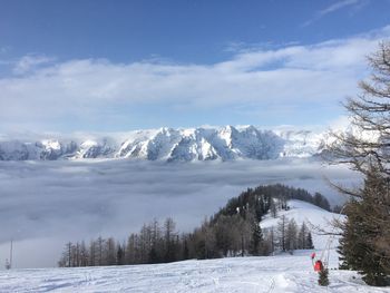 View of snowcapped mountain against cloudy sky