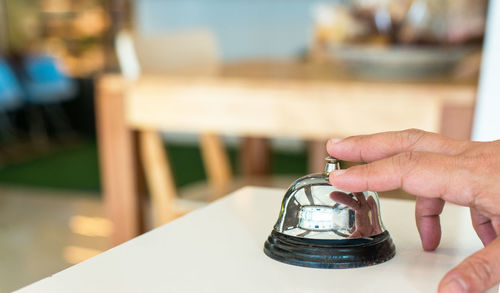 Close-up of hand on table