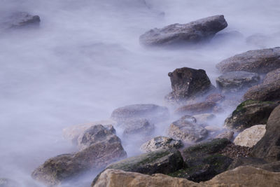 Scenic view of rocks in sea