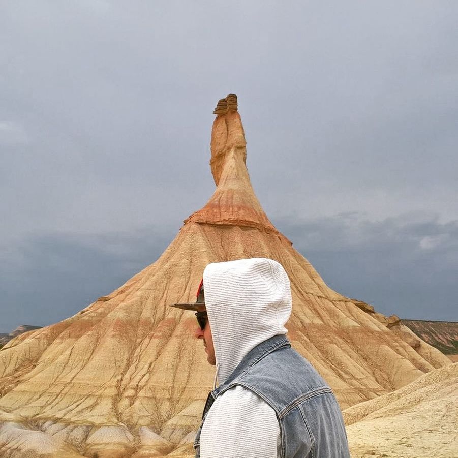 one person, one man only, day, outdoors, low angle view, desert, physical geography, nature, only men, adults only, arid climate, adult, sky, people, human body part, men