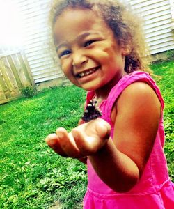 Portrait of girl playing in park