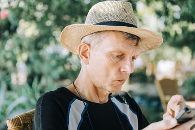 Portrait of man wearing hat