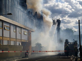 Water being sprayed on building during fire