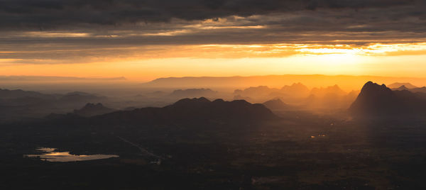 Scenic view of mountains against sky during sunset