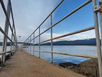 Bridge over sea against sky