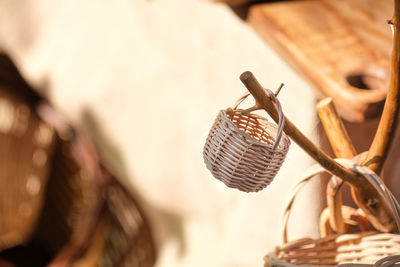 Close-up of clothes hanging on wicker basket