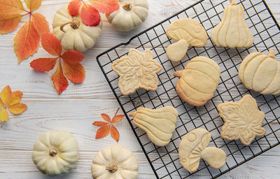 Autumn baking. cookies in the form of pumpkin and leaves on the table. cozy autumn concept.