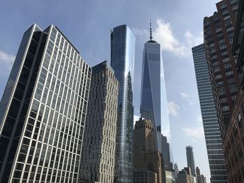 Low angle view of freedom tower against sky in new york city.