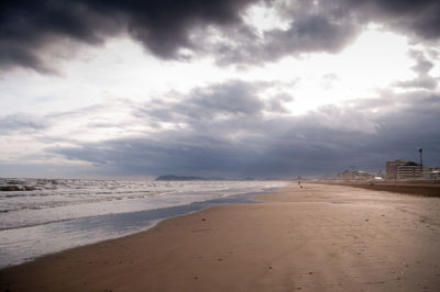 Winter seaside landscape .few people gloomy and cloudy atmosphere