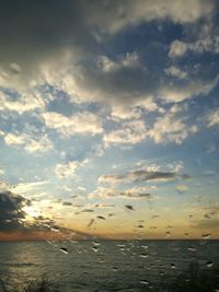 Scenic view of sea against dramatic sky