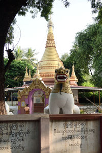 Statue of temple against building