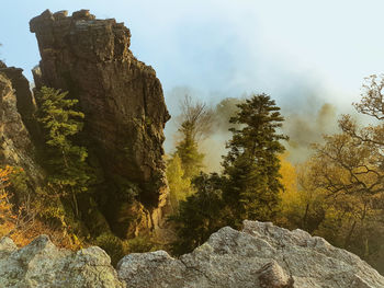 Low angle view of rocks against sky