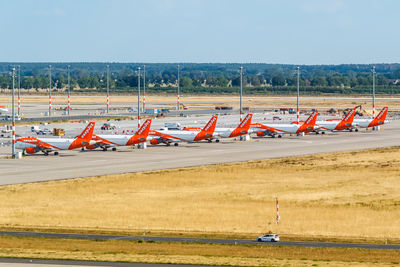 Airplane on runway against sky