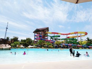 People at water park against sky