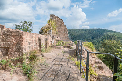 Old ruin building against cloudy sky