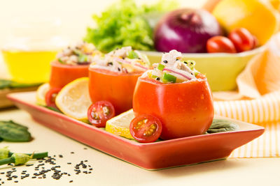 Tomatoes in plate on table