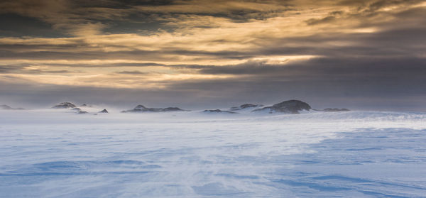 Scenic view of sea against sky during winter