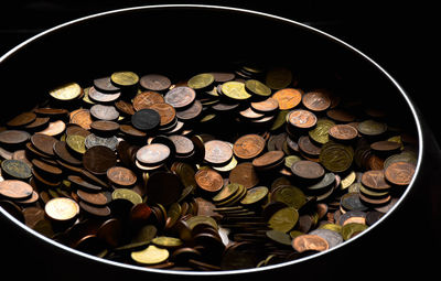 High angle view of coins in container