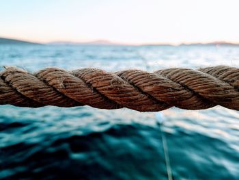 Close-up of rope tied on metal