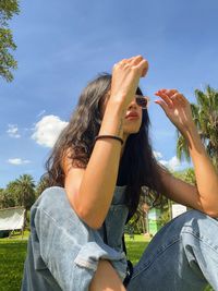 Side view of woman using mobile phone