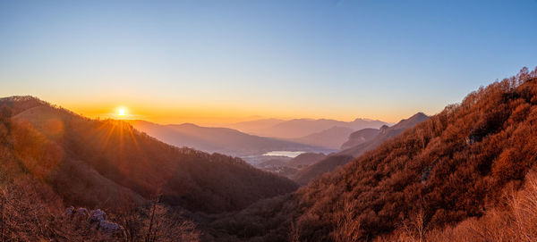 Scenic view of mountains against sky during sunset