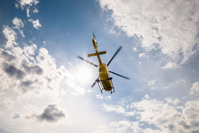 Low angle view of airplane flying against sky