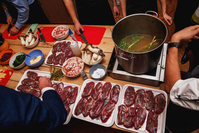 Process of cooking meat and soup at masterclass in restaurant