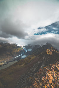 Aerial view of landscape against cloudy sky