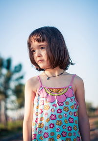 Little girl having fun outdoors in sunset