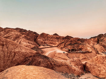 Rock formations in desert against clear sky