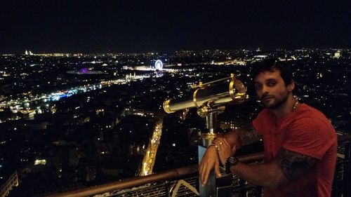 Low angle view of illuminated city at night