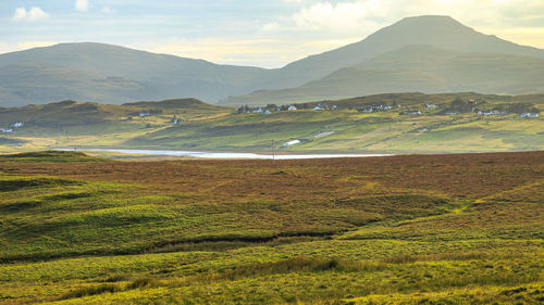 Scenic view of landscape and mountains against sky