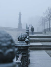 Statue against sky during winter