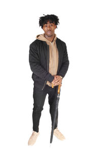 Portrait of young man standing against white background