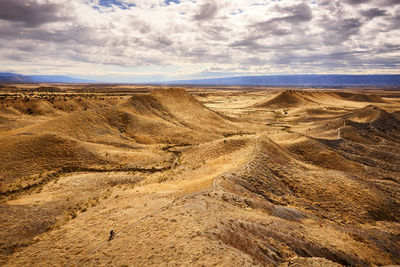 An overhead shot of a mountain biker on a trail in colorado.