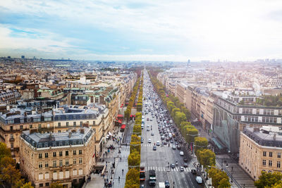 High angle view of street amidst buildings against sky