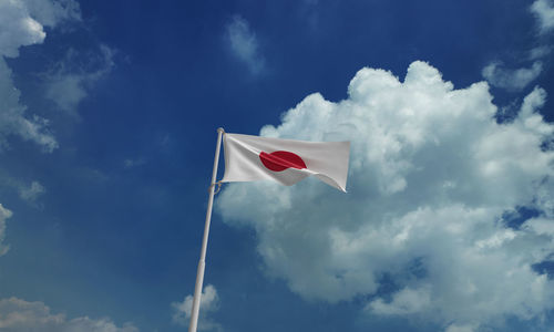 Low angle view of flag against sky