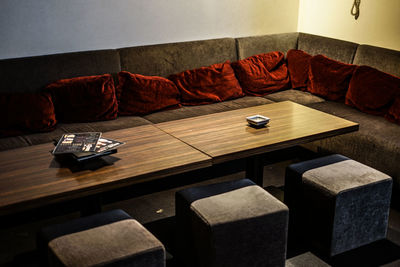 High angle view of empty chairs and table at home