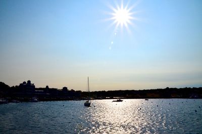 Scenic view of river against sky at sunset