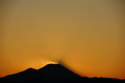 Scenic view of mountains at sunset