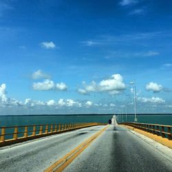 Bridge over sea against sky