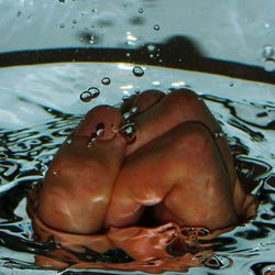 Close-up of wet man in water