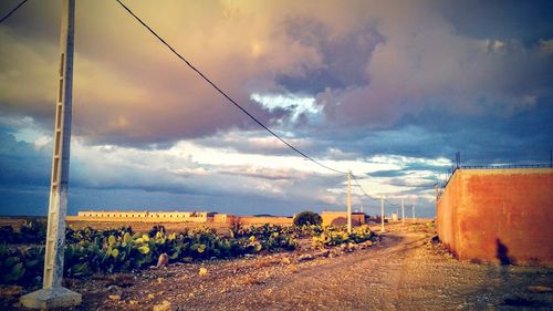 View of railroad tracks against cloudy sky