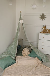 Children's tent tent with pillows and a soft toy bunny in the room for small children